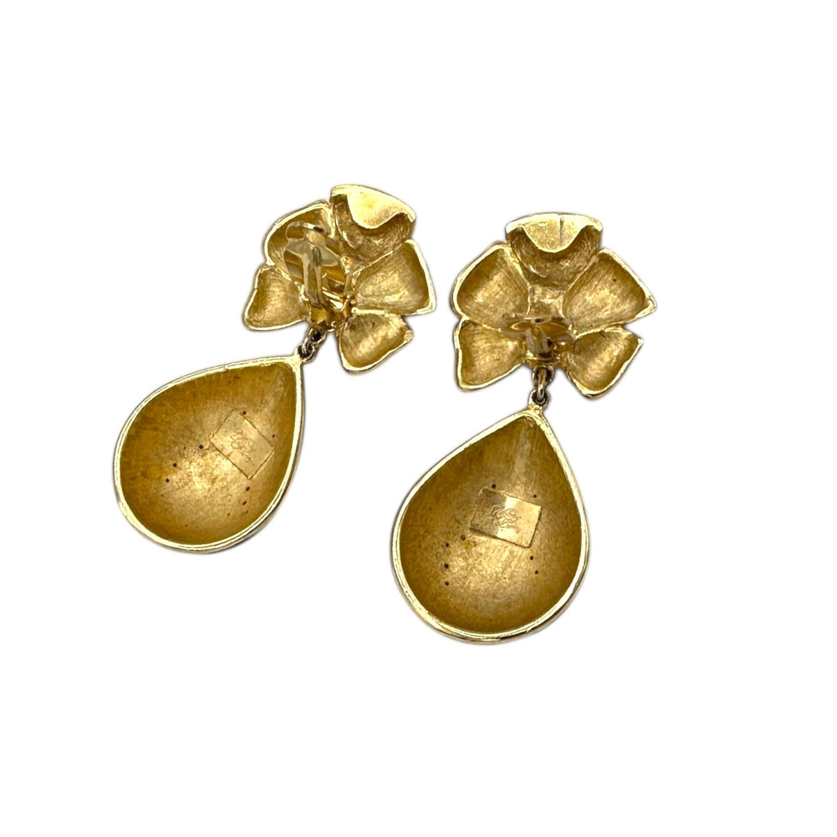 Back view with clips up of Whiting & Davis vintage red enamel bow and teardrop rhinestone dangle clip-on earrings, gold-tone statement jewelry on white background.