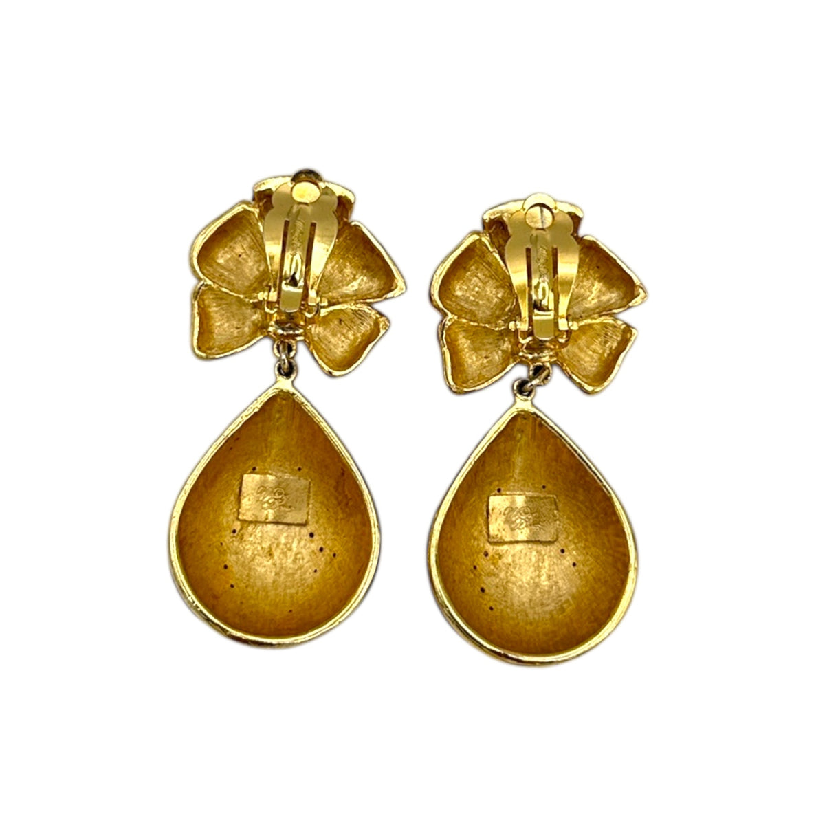 Back view of Whiting & Davis vintage red enamel bow and teardrop rhinestone dangle clip-on earrings, gold-tone statement jewelry on white background.